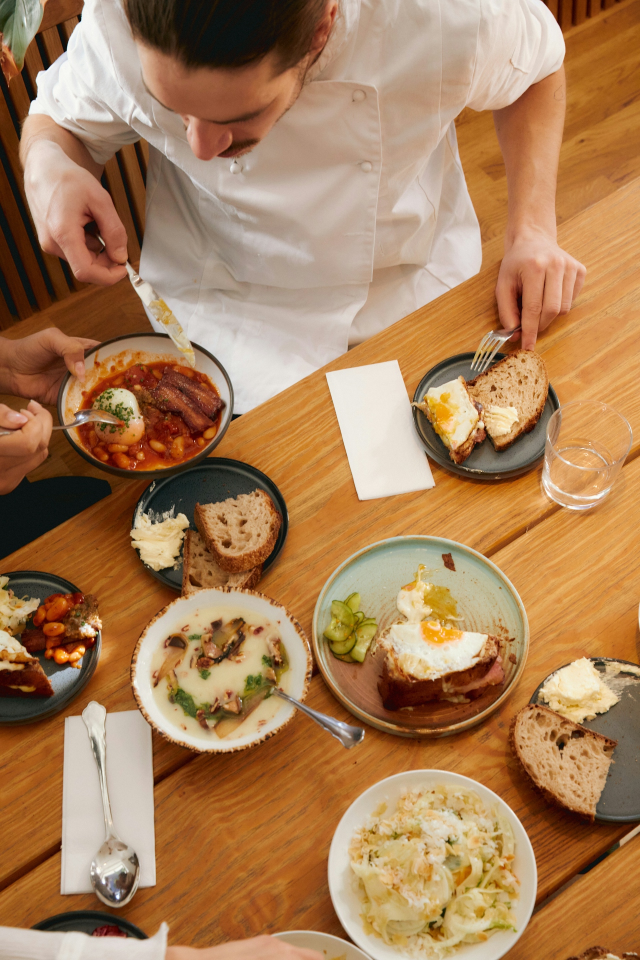 Chef prepping isolated stations in high-end kitchen